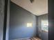 Simple bedroom with grey walls and a small window awaits customization at 5625 Van Doren Ave, New Port Richey, FL 34652
