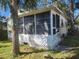 A one-story home featuring a screened lanai and mature landscaping at 5625 Van Doren Ave, New Port Richey, FL 34652
