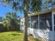 Charming one-story home featuring mature landscaping and a screened lanai at 5625 Van Doren Ave, New Port Richey, FL 34652
