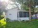 One-story home with mature landscaping and a screened-in lanai at 5625 Van Doren Ave, New Port Richey, FL 34652