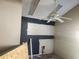 A kitchen space with unfinished walls and ceiling fan awaits renovation at 5625 Van Doren Ave, New Port Richey, FL 34652