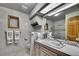 Bathroom with vanity, toilet, and walk-in shower with silver accents at 5747 Fieldspring Ave, New Port Richey, FL 34655