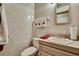 Cozy bathroom features decorative towels, vanity with sink, and mirror at 5747 Fieldspring Ave, New Port Richey, FL 34655