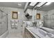 Bathroom featuring an integrated sink, patterned tile, and sliding shower doors at 5747 Fieldspring Ave, New Port Richey, FL 34655