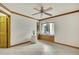 Bright bedroom featuring a window seat, tiled floors, and a ceiling fan at 5747 Fieldspring Ave, New Port Richey, FL 34655
