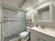 Updated bathroom featuring a marble-tiled shower, new vanity, and updated fixtures at 6601 Nautical Isle, Hudson, FL 34667