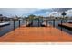 Waterfront dock featuring wood plank floors, decorative touches, and gate access to the open water at 6601 Nautical Isle, Hudson, FL 34667