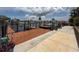 Waterfront dock featuring wood plank floors, decorative touches, and gate access to the open water at 6601 Nautical Isle, Hudson, FL 34667