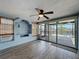 Comfortable living room with tiled floors and view of patio and water at 6601 Nautical Isle, Hudson, FL 34667