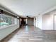 Spacious living room featuring wood-look floors and a stone fireplace at 6601 Nautical Isle, Hudson, FL 34667