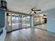Bright living room with sliding glass doors leading to patio and pool at 6601 Nautical Isle, Hudson, FL 34667