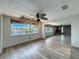 Open living room featuring wood-look floors and a beautiful water view at 6601 Nautical Isle, Hudson, FL 34667