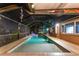 Inviting screened pool area with brick pavers and fun decor, perfect for entertaining guests and enjoying outdoor leisure at 6601 Nautical Isle, Hudson, FL 34667