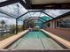Spacious screened pool with clear blue water, offering serene waterfront views and delightful backyard setting at 6601 Nautical Isle, Hudson, FL 34667