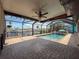 Relaxing pool area with brick patio, waterfront view, and colorful decor at 6601 Nautical Isle, Hudson, FL 34667