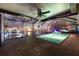 Inviting screened-in pool area with unique decor and stylish lighting for evening swims at 6601 Nautical Isle, Hudson, FL 34667