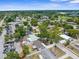 Aerial view of the neighborhood and some nearby commercial areas with parking at 6633 Jackson St, New Port Richey, FL 34653