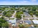 Aerial view showcasing the residential neighborhood with mature trees and well-maintained streets at 6633 Jackson St, New Port Richey, FL 34653