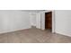 Spacious bedroom with tile floors, a closet with wood slats, and freshly painted walls at 6633 Jackson St, New Port Richey, FL 34653