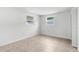 Clean bedroom features tile floors, freshly painted walls, and natural light at 6633 Jackson St, New Port Richey, FL 34653