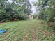 Backyard featuring an outbuilding, ready for transformation among the natural surroundings at 7100 Ashwood Dr, Port Richey, FL 34668