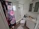 Bathroom with a shower-tub combo with a floral shower curtain at 7100 Ashwood Dr, Port Richey, FL 34668