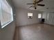 Bedroom with tile floors, ceiling fan, and natural light at 7100 Ashwood Dr, Port Richey, FL 34668