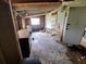 Unfinished living room featuring wood beams and a window awaiting restoration for personalized design at 7100 Ashwood Dr, Port Richey, FL 34668