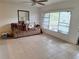 Bright living room featuring tile floors, neutral walls and a large window that brings in natural light at 7100 Ashwood Dr, Port Richey, FL 34668