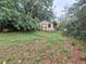 Backyard outbuilding providing additional space and surrounded by nature offering privacy at 7100 Ashwood Dr, Port Richey, FL 34668