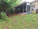 Screened-in patio offering shade and open-air living space for outdoor enjoyment at 7100 Ashwood Dr, Port Richey, FL 34668