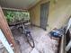 Enclosed back porch area, offering an outdoor spot ready for creative customization at 7100 Ashwood Dr, Port Richey, FL 34668