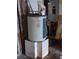 Water heater sitting on top of concrete blocks at 7100 Ashwood Dr, Port Richey, FL 34668