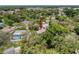 Overhead shot of a home showcasing its location, mature landscaping, and pool at 7119 Lenape Cir, New Port Richey, FL 34653