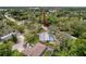 An aerial shot of a home with a pool; note how this corner lot provides generous space between neighbors at 7119 Lenape Cir, New Port Richey, FL 34653