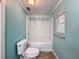 Cozy bathroom with a bathtub, shower combination, and a window for natural light at 7119 Lenape Cir, New Port Richey, FL 34653