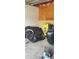 Garage interior with some personal items inside the unfinished space at 7119 Lenape Cir, New Port Richey, FL 34653