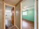 Hallway showing access to rooms, each with unique features and flooring at 7119 Lenape Cir, New Port Richey, FL 34653