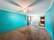 Functional laundry area with machines, adjacent to the kitchen and featuring a ceiling fan at 7119 Lenape Cir, New Port Richey, FL 34653