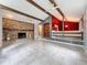 Open living room features a stone fireplace and vaulted ceilings with wood beams at 7119 Lenape Cir, New Port Richey, FL 34653