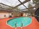 Sparkling pool under a screened enclosure, ready for relaxation and fun gatherings at 7119 Lenape Cir, New Port Richey, FL 34653