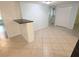 Open dining area features bar seating and tile flooring at 7313 Hatteras Dr, Hudson, FL 34667