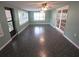 Dining area with stylish tile floors, ample windows, and a french door at 7313 Hatteras Dr, Hudson, FL 34667