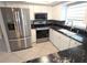 Well-lit kitchen with stainless steel appliances and modern countertops at 7313 Hatteras Dr, Hudson, FL 34667