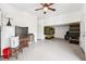 Bonus room with lots of storage featuring two entry doors, a window, and various household items at 7340 Brightwaters Ct, New Port Richey, FL 34652