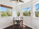 Sunlit breakfast nook with picturesque views and a cozy table with chairs at 7340 Brightwaters Ct, New Port Richey, FL 34652