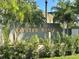Homes of Oyster Bayou community sign with lush landscaping and palm trees on a sunny day at 7340 Brightwaters Ct, New Port Richey, FL 34652