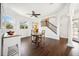 Open dining area features hardwood floors, lots of natural light, and a modern ceiling fan at 7340 Brightwaters Ct, New Port Richey, FL 34652