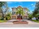 Stately home with a manicured front yard, two-car garage, and inviting entryway at 7340 Brightwaters Ct, New Port Richey, FL 34652