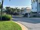 View of a secure gated entrance to an exclusive neighborhood with well-maintained landscaping and attractive homes at 7340 Brightwaters Ct, New Port Richey, FL 34652
